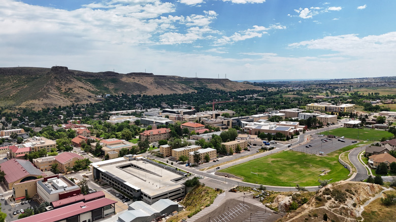 An aerial photo of Golden, Colorado backing up to the foothills of the Rocky Mountains