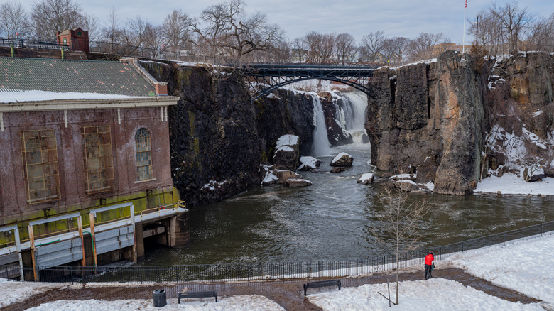 Winter landscape at Paterson Great Falls National Historical Park with bridge and falls in the background
