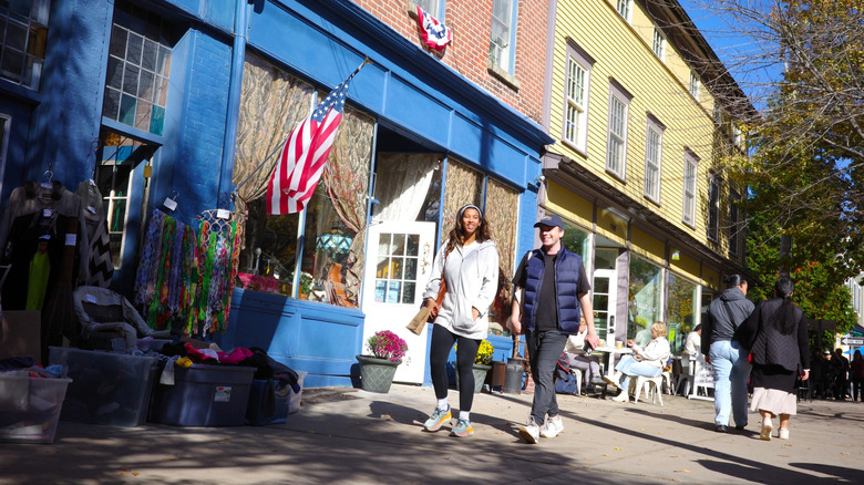 People walking in front of shops in the historic district of Cold Spring