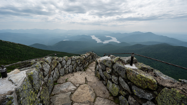 stone trail overlooking mountains on overcast day
