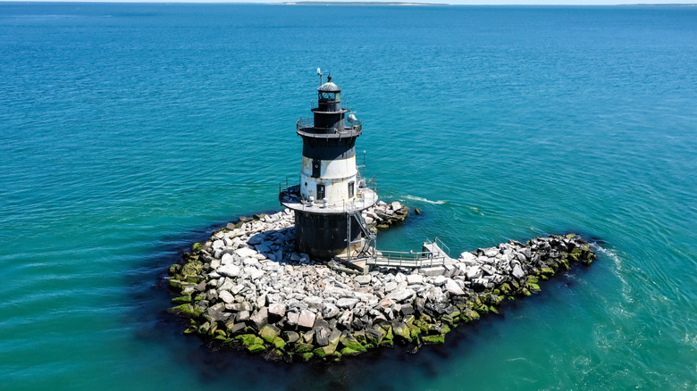 Orient point lighthouse on a small inlet with clear blue waters
