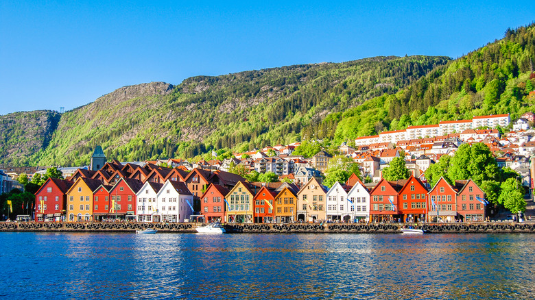 The colorful streets of Bergen's historic Bryggen district from the water, Norway