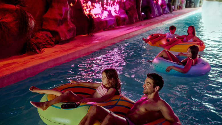A rendering of Great Tides Waterpark's Wandering River shows guests floating through a tunnel on innertubes.