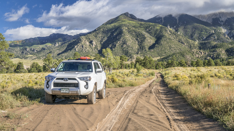 A vehicle navigating the Medano Pass Road in Great Sand Dunes National Park