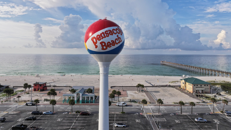 Pensacola Beach sign towering over the pier and shoreline