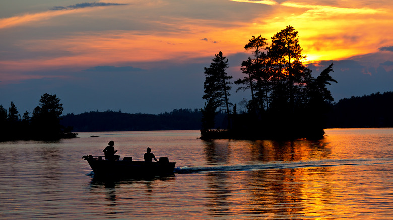 A boat in Burntside Lake in Superior National Forest at sunset