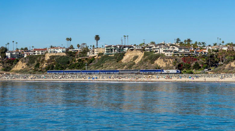 Amtrak's Pacific Surfliner train travels between San Diego and Los Angeles, passing the beach in San Clemente, California.
