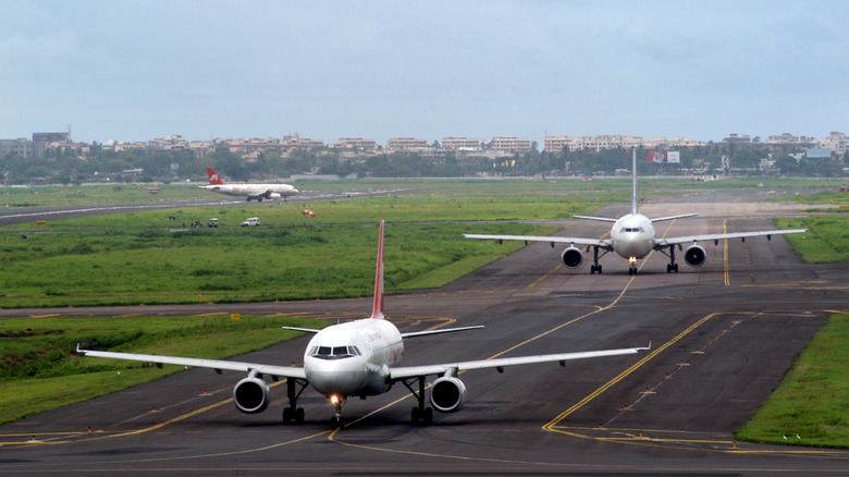 Airplanes taxing on a runway