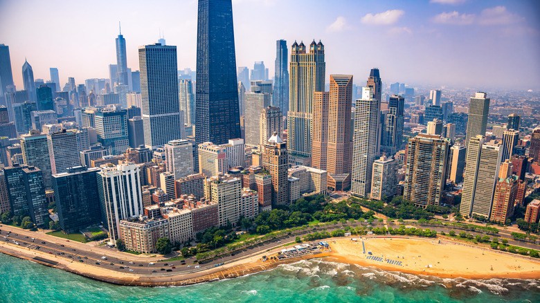 A photo of Oak Street Beach and the Chicago skyline behind it, taken from a helicopter