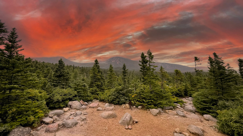 Red and pink twilight clouds over Baxter State Park and Mount Katahdin, Maine