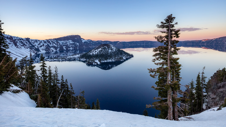 Crater Lake pictured in the winter with snow, in Crater Lake National Park, Oregon.