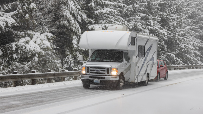 An RV drives on a snowy road in Oregon.