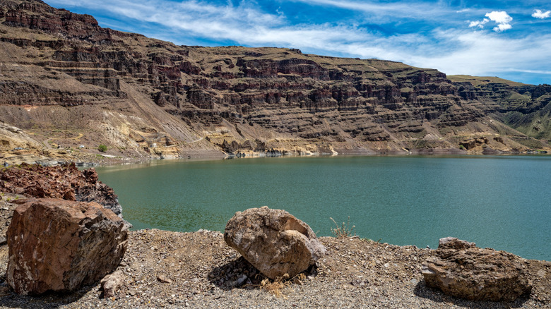 Three large boulders beside the shore at Owyhee Reservoir in Oregon