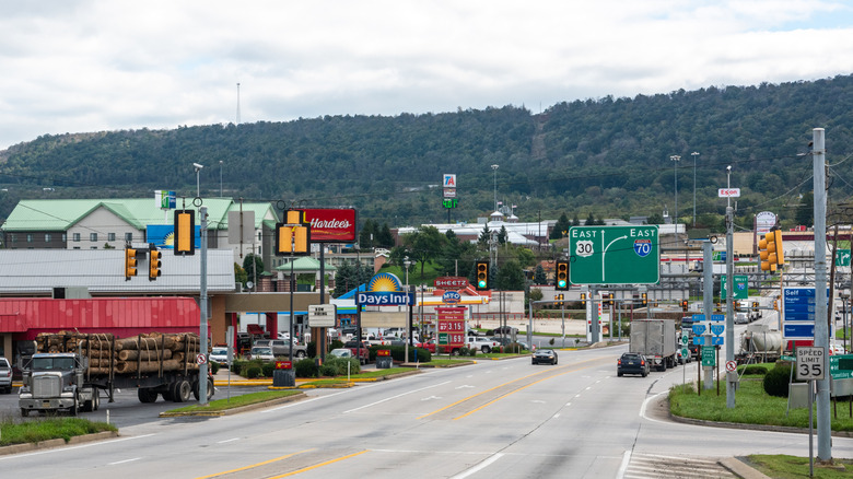 A street in Breezewood, Pennsylvania, lined with chain business signs