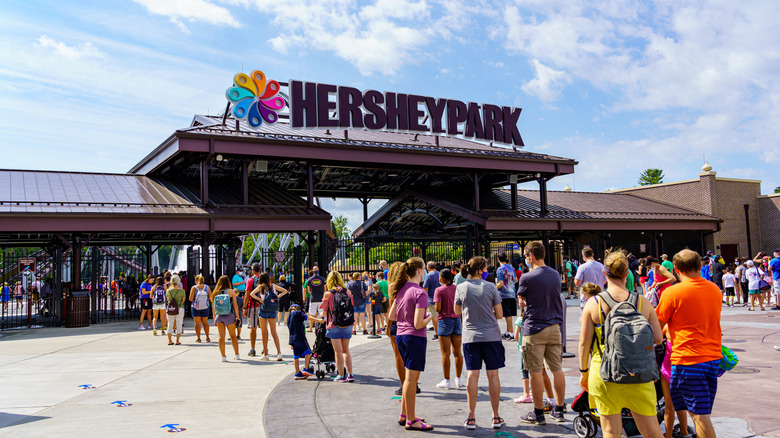 Visitors stand in line at the entrance of Hersheypark