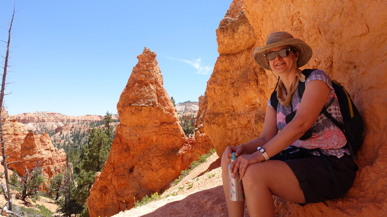 Woman Hiker sitting in the shade during a hike in the American Southwest.