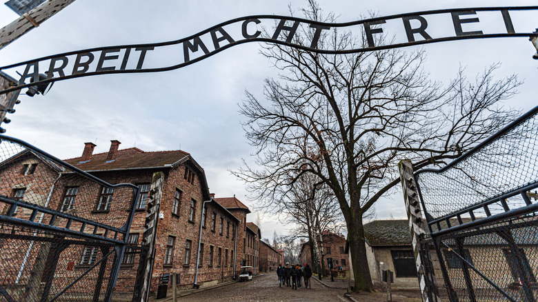 Entry gates to Auschwitz-Birkenau concentration camp on a gloomy day