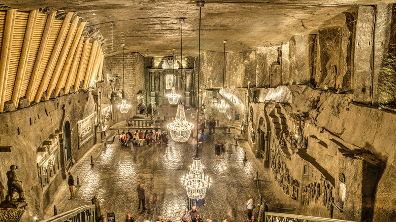 Overview of cathedral with ornate chandeliers in Poland's Wieliczka Salt Mines