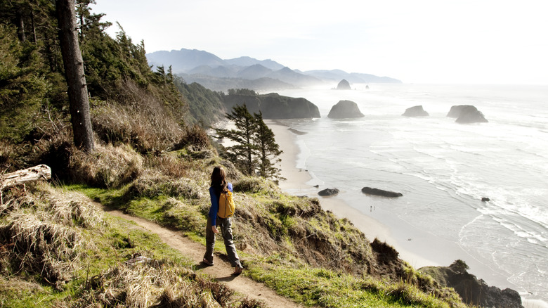 A hiker walks along the Oregon coast