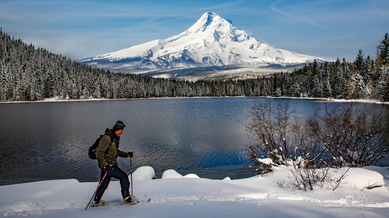 A snowshoer walks around Trillium Lake near Mt. Hood