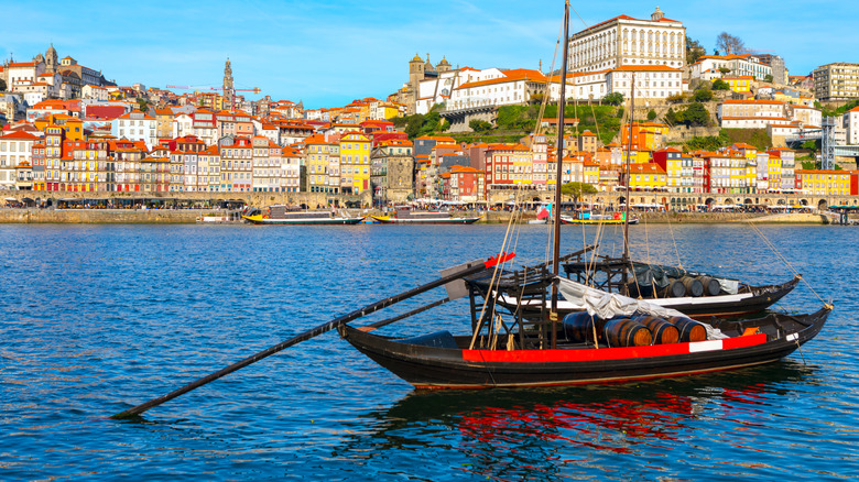 Traditional rabelo boat on the Douro River with Ribeira District in background
