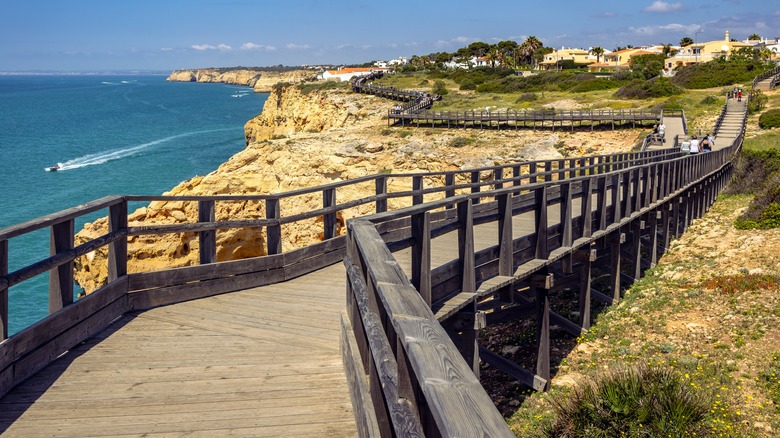 Cliffside boardwalk along the coast of Carvoeiro, Portugal