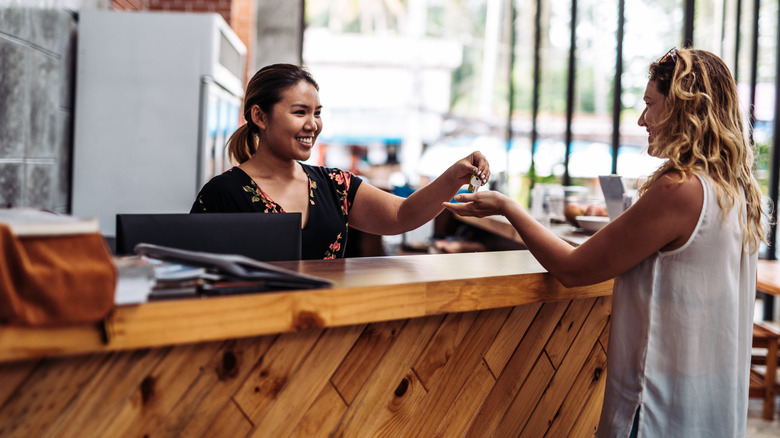 Traveler checking into a small hotel
