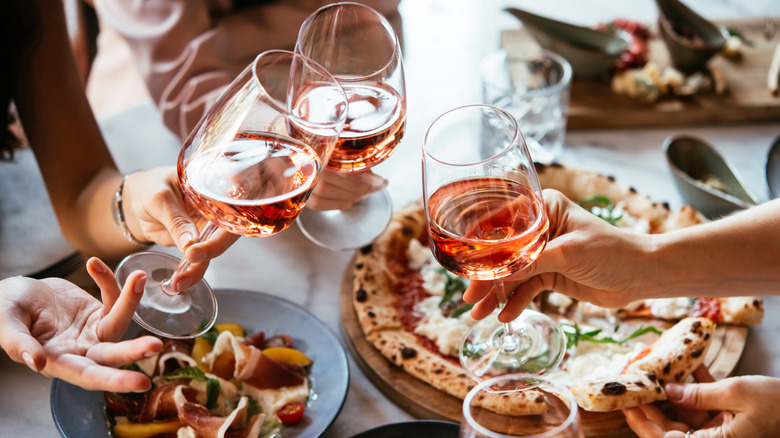 People toasting during a meal in Italy