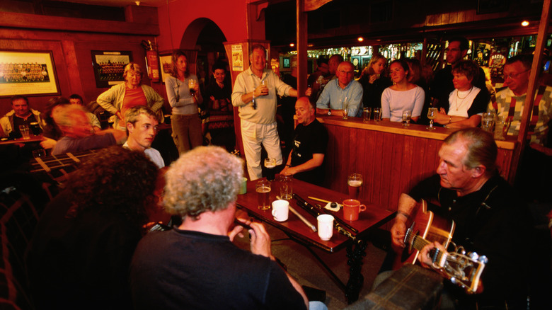 Pubgoers watching a traditional music session in Doolin, Ireland