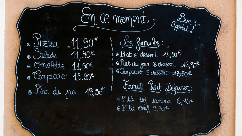 A handwritten chalkboard menu in France with fixed-price options