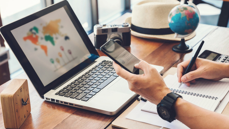 A man planning his trip abroad