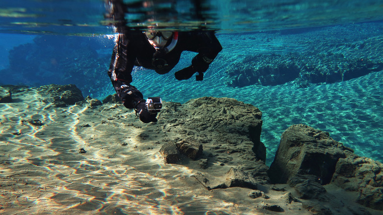A person snorkeling in blue water