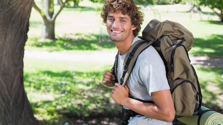 Traveler carrying a backpack with padded straps