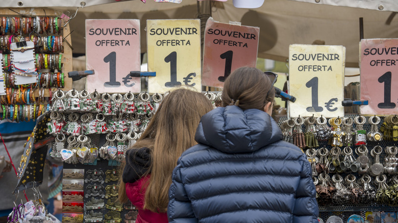 People browsing souvenirs to take home in Rome