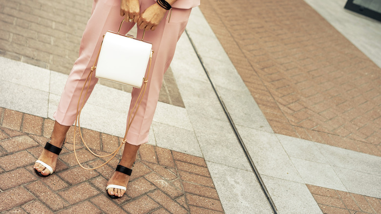Person in a pastel outfit and heels
