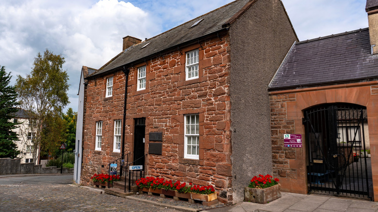 The brown stone exterior of the Robert Burns House in Dumfries, Scotland