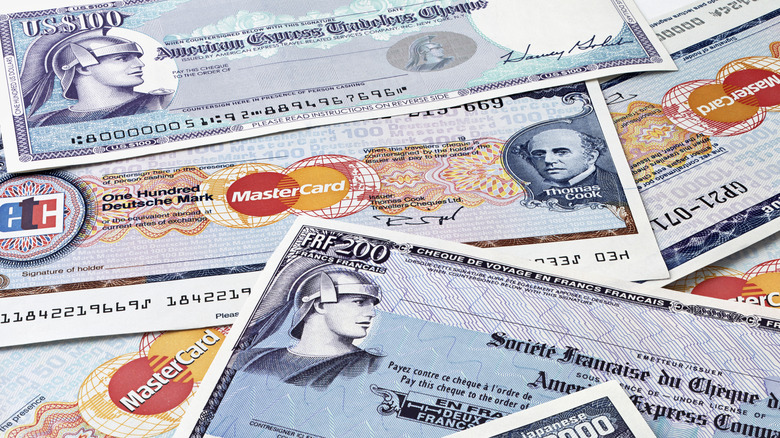 Traveler's checks spread out in a pile