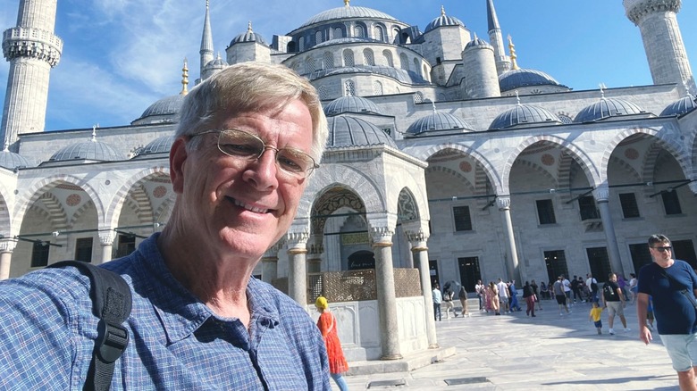 Rick Steves taking a selfie in front of the Blue Mosque