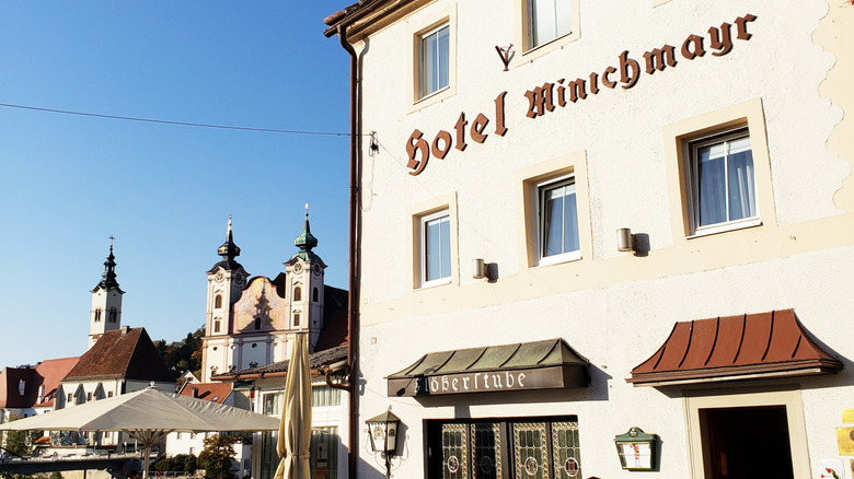 European hotel with cathedral in the background