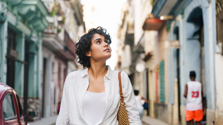 Traveler walking along a street in Havana