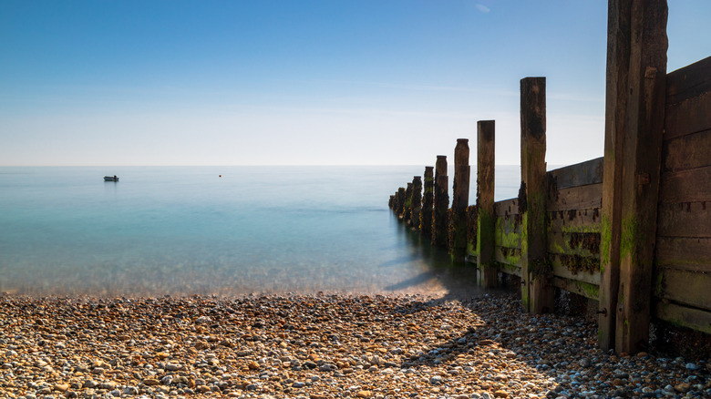 A tranquil coastal scene in Selsey with pebbles leading to the water