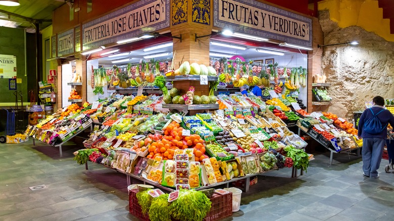 A colorful fruit stall at the Mercado de Triana, Seville