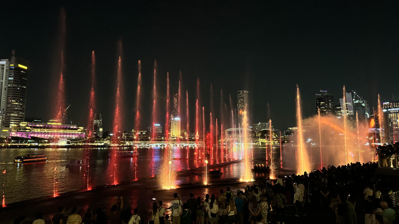 Red fountains and projections during the "Spectra" light and water show