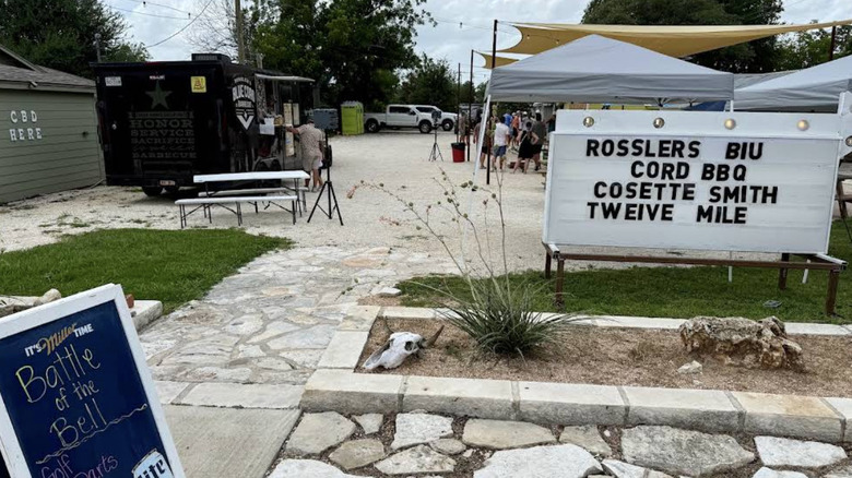An outdoor dining area outside of Rossler's Blue Cord BBQ in Harker Heights, Texas