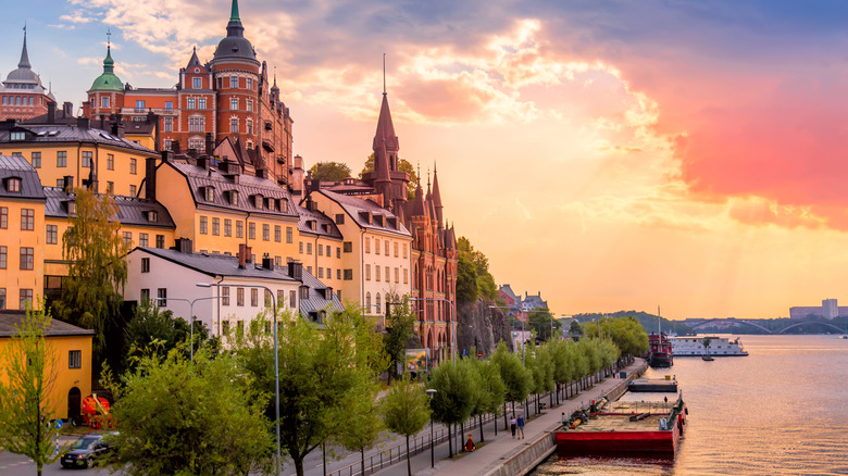Stockholm homes and waterside walking path at sunset
