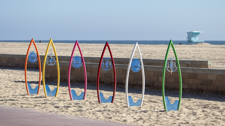 Metal surfboard silhouettes on the beach in Huntington Beach, California