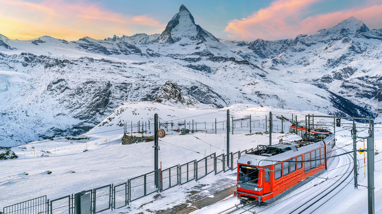 A scenic railway and the Matterhorn in the distance