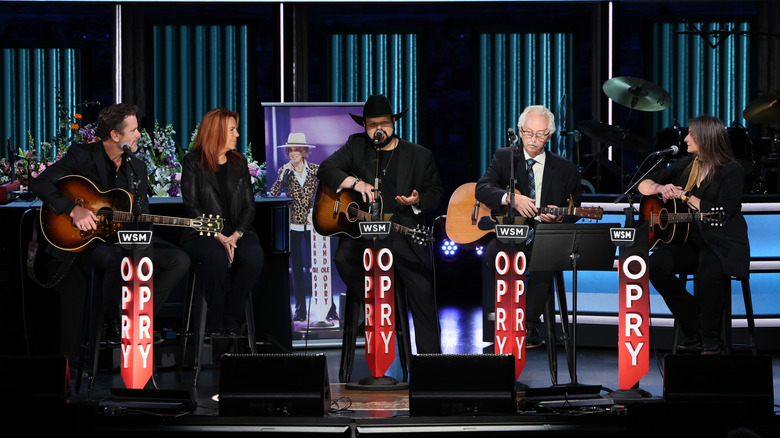 Charles Esten, Victoria Shaw, Bobby Tomberlin, Buddy Cannon and Erin Enderlin perform onstage the Grand Ole Opry House.