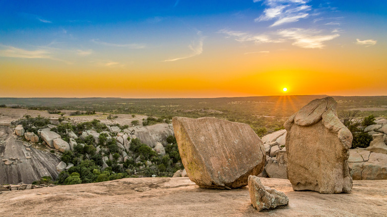 Sunset at Enchanted Rock State Natural Area, with rocks in the foreground