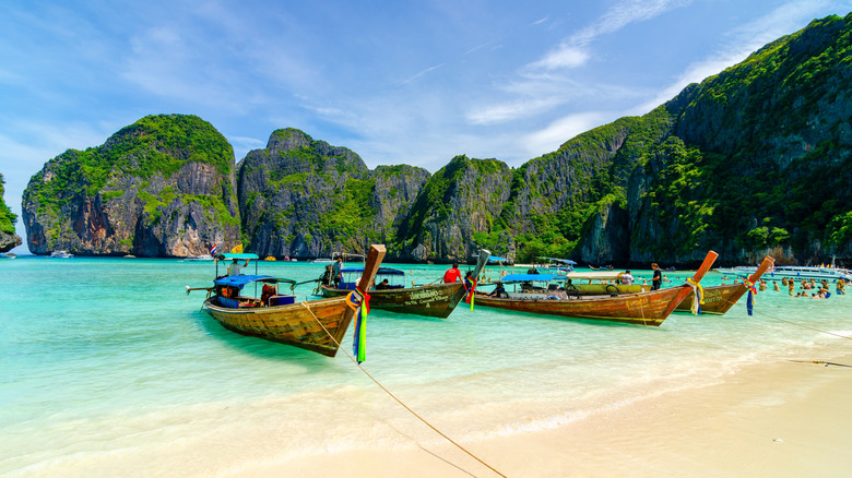 Traditional Thai long boats on a beach near Phuket, Thailand